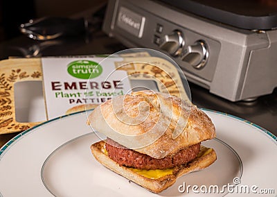 Simple Life Emerge plant based burger in on bun with melted cheese Editorial Stock Photo