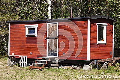 A simple and mobile summer house in red wood Stock Photo