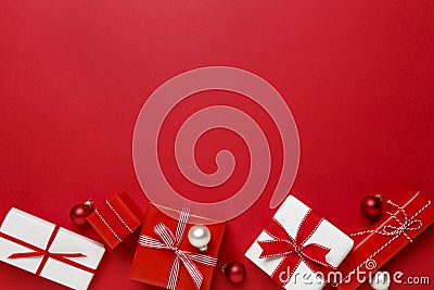 Simple, modern red & white Christmas gifts presents on red background. Festive holiday border. Stock Photo