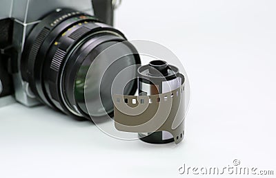 Simple old analog camera with film on white background Stock Photo