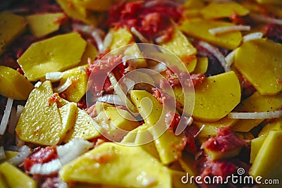 A simple recipe for food. Baked potatoes with red fish in the oven. Ready lunch on a close-up tray Stock Photo