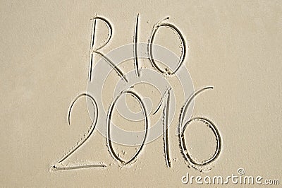 Simple Rio 2016 Message Handwritten on Sand Beach Stock Photo