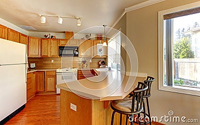 Simple standart American wood kitchen with hardwood floor. Stock Photo