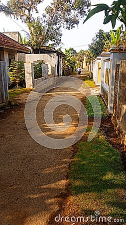 A Simple Walk In The Village With Peaceful Housing Surroundings Stock Photo