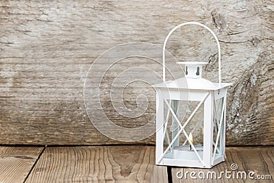 Simple white lantern on wooden background Stock Photo