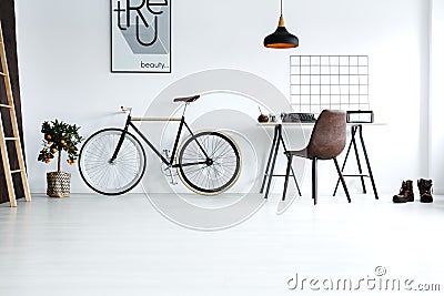 Simple, white room with bike Stock Photo