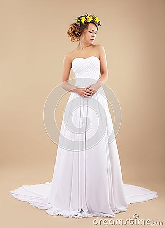 Simplicity. Minimalism. Bride with Wildflowers in Classic Dress Stock Photo