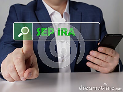 Simplified employee pension individual retirement account SEP IRA phrase on the screen. Modern Banker use cell technologies at Stock Photo