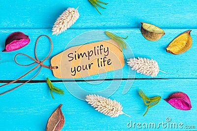 Simplify your life text on paper tag Stock Photo