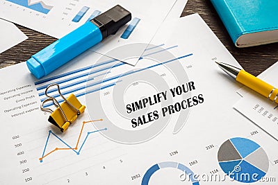 Simplify Your Sales Process inscription on the page Stock Photo