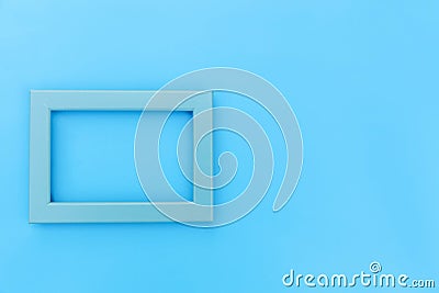 Simply design with empty blue frame isolated on blue pastel colorful background Stock Photo