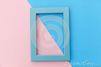 Simply design with empty blue frame isolated on pink and blue pastel colorful background Stock Photo