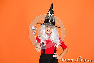 Simply happy. kid enchantress wave magic wand. happy halloween. believe in magic. smiling girl halloween party. mystery Stock Photo