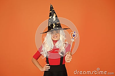 Simply happy. kid enchantress wave magic wand. happy halloween. believe in magic. smiling girl halloween party. mystery Stock Photo