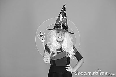 Simply happy. kid enchantress wave magic wand. happy halloween. believe in magic. smiling girl halloween party. mystery Stock Photo