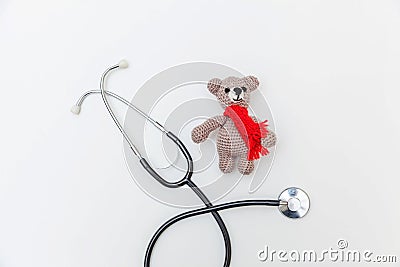 Simply minimal design toy bear and medicine equipment stethoscope isolated on white background. Health care children doctor Stock Photo
