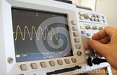 Sine wave on oscilloscope screen Stock Photo