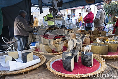 Sineu, Majorca. Market stall that sells different types of typical sheep and goat cheese Editorial Stock Photo