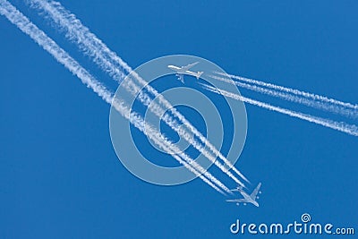 Singapore Airlines Airbus A380 flying at cruising altitude with a Lufthansa Boeing 747 flying in close proximity. Editorial Stock Photo