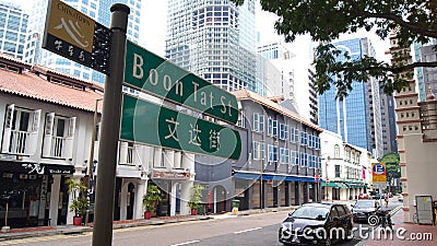 SINGAPORE - APR 2nd 2015: Bilingual Street Sign in Singapore Chinatown. Singapore is a multi-racial city where English Editorial Stock Photo