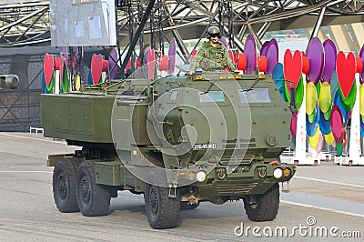 Singapore Armed Forces (SAF) demonstrating its high mobility artillery rocket system (HIMARS) during National Day Parade 2013 Editorial Stock Photo