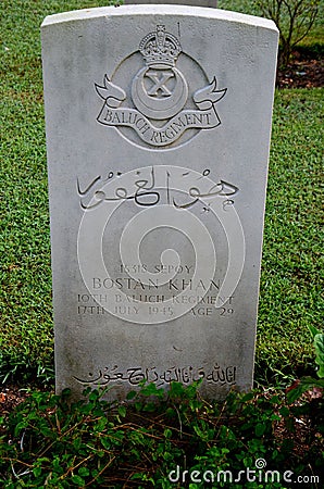 Tombstone of Pakistani soldier from Baloch Regiment in British Indian Army at Kranji Cemetery Singapore Editorial Stock Photo