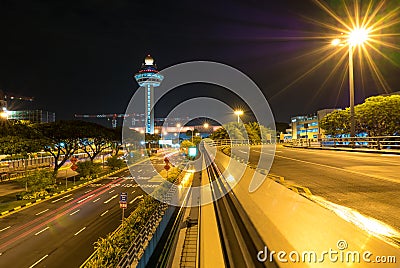 Singapore Changi Airport at night with air traffic control tower Editorial Stock Photo