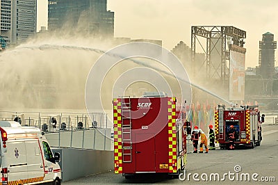 Singapore Civil Defense Force (SCDF) compressed air foam engine spraying water jets during National Day Parade Rehearsal 2013 Editorial Stock Photo