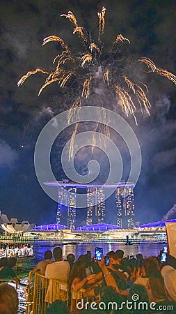 SINGAPORE - DECEMBER 31, 2019: Tourists and locals enjoy the fireworks in Marina Bay Editorial Stock Photo