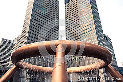 Singapore famous travel destination fountain of wealth against high skyscrapers towers in finan Editorial Stock Photo