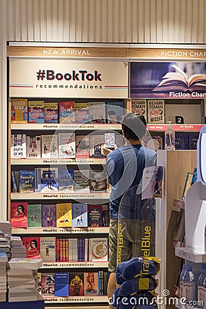 Customers shop for books in Changi Airport Singapore Editorial Stock Photo