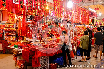 Singapore, Jan 1 2023 - Locals shopping for Chinese New Year ornaments home decoration in Chinatown night market Editorial Stock Photo