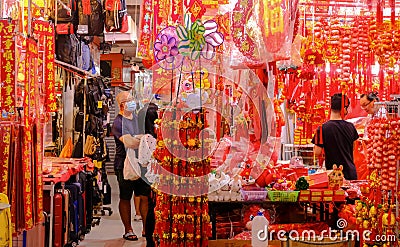 Singapore, Jan 1 2023 - Locals shopping for Chinese New Year ornaments home decoration in Chinatown night market Editorial Stock Photo