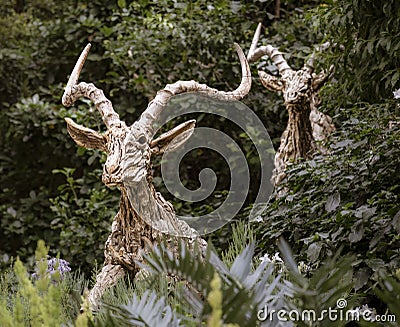 Singapore, July 24, 2022 - Statue of antelopes leaping through a forest Editorial Stock Photo