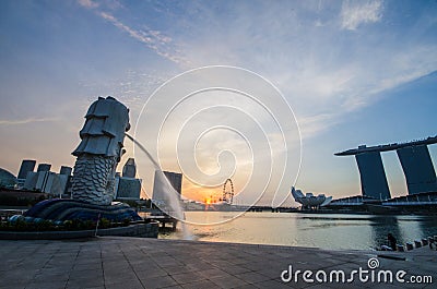 SINGAPORE - June 6 : Merlion park at dawn with sunrise scene in Editorial Stock Photo