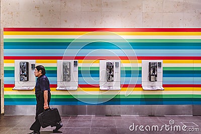 Singapore, june, 2019. Public phones at Singapore Changi Airport, is a major civilian airport that serves Singapore, and is one of Editorial Stock Photo