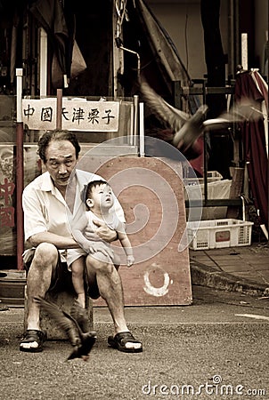 Family bonding of a grandfather holding his grandchild Editorial Stock Photo