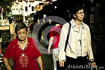 In Singapore, locals and foreign migrants live closely Editorial Stock Photo