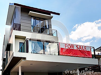 SINGAPORE, 15 MARCH 2019 - Low angle off-centre view of a house for sale with red Editorial Stock Photo