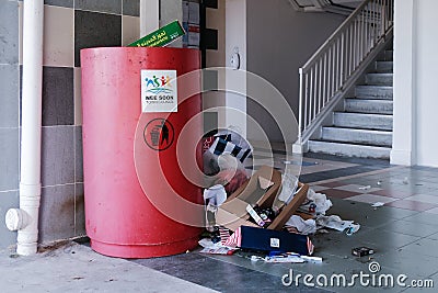 Singapore May2021 Eyesore at common void deck of HDB estate in Yishun. Overflowing trash bin caused by thoughtless irresponsible Editorial Stock Photo