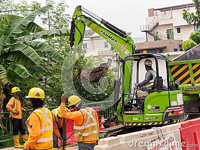 SINGAPORE - 3 MAY 2019 - Foreign Bangladeshi Indian construction workers at a road works site in Singapore Editorial Stock Photo