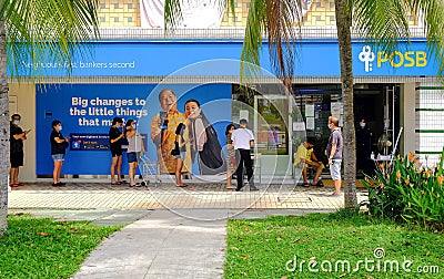 Singapore May2020 People queueing outside local bank POSB observing safe social distancing. Staff ambassadors limiting access to r Editorial Stock Photo