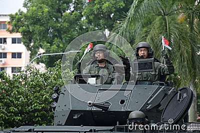 A Singapore military army tank driving past the heartlands at Jurong West Avenue 5 during the nation`s 55th National Day Editorial Stock Photo