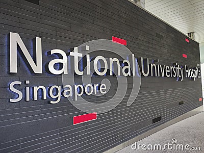 Singapore National University Hospital banner in front of the hospita Editorial Stock Photo