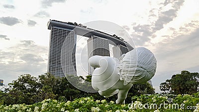 SINGAPORE, SINGAPORE - OCTOBER 27, 2018: Baby sculpture in Gardens by the Bay with Marina Bay Sans hotel in background Editorial Stock Photo