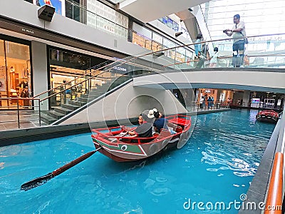 SINGAPORE - 12 October 2018: Canal and boat at The Shoppes at Marina Bay Sands Shopping Center in Singapore Editorial Stock Photo