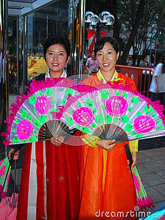Singapore: Two Korean Women with Fans Editorial Stock Photo