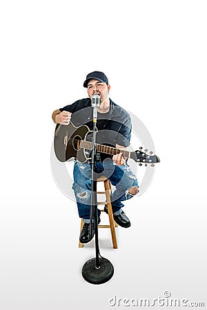 Singer Acoustic Guitarist on White strumming Stock Photo