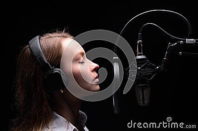 Singer, blogger, voice acting. Work in the studio with a studio microphone Stock Photo