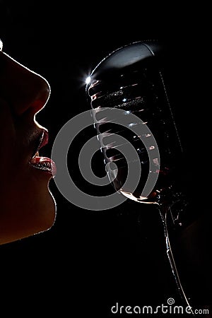 Singer with microphone Stock Photo